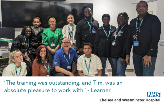 Trainer Tim and a group of happy learners