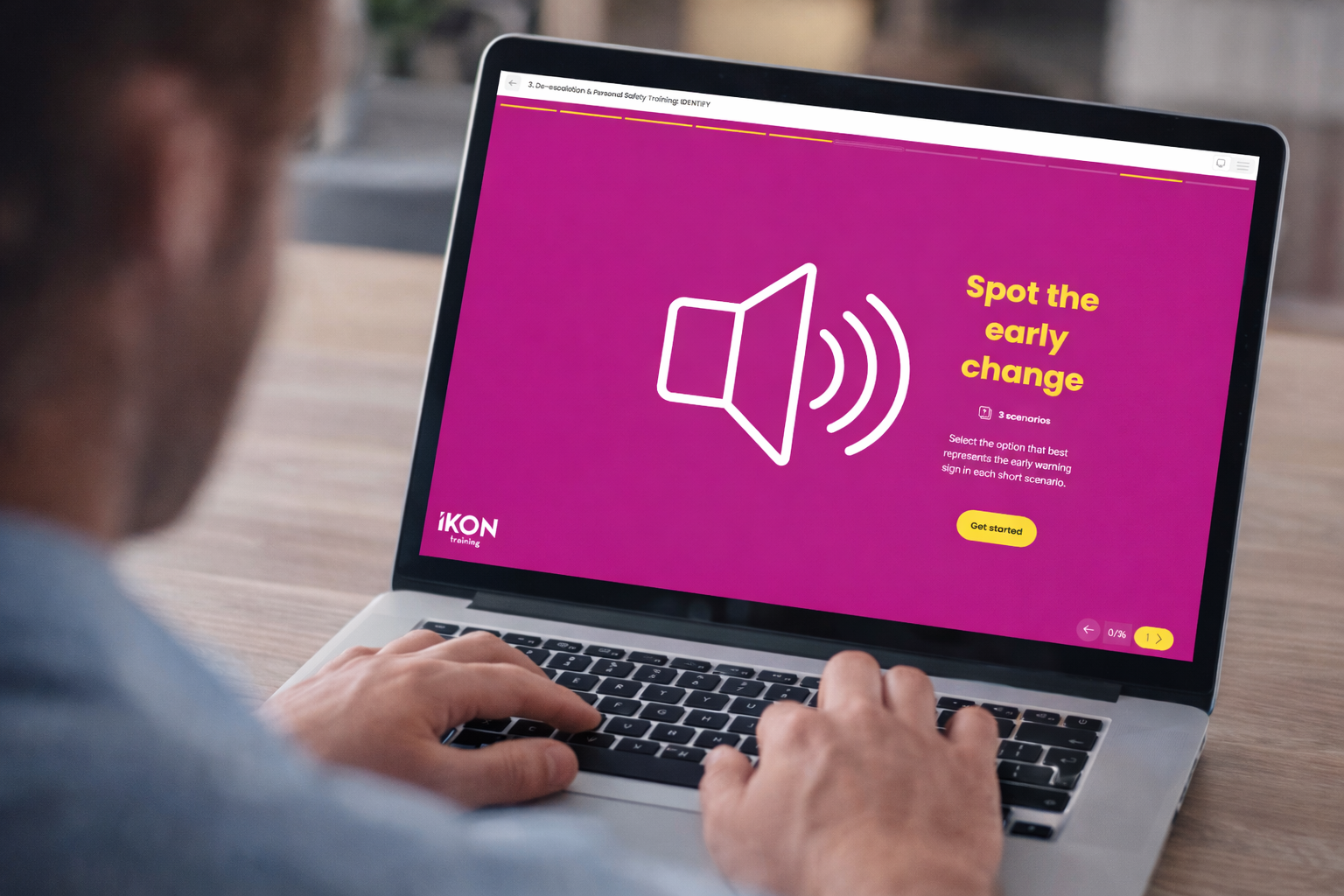 Man looking at a laptop with Purple background with a volume symbol, saying spot the early change.